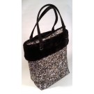 Borsa in PVC, rifinita con ecopelo nero- motivo sassi piccoli